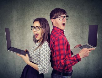 Surprised Funny Looking Man And Woman With New Laptops